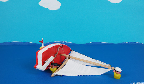 Figure 134: The heavier crewmember swims to the masthead and prevents the boat from turning to turtle. The lighter crewmember releases all the sheets.