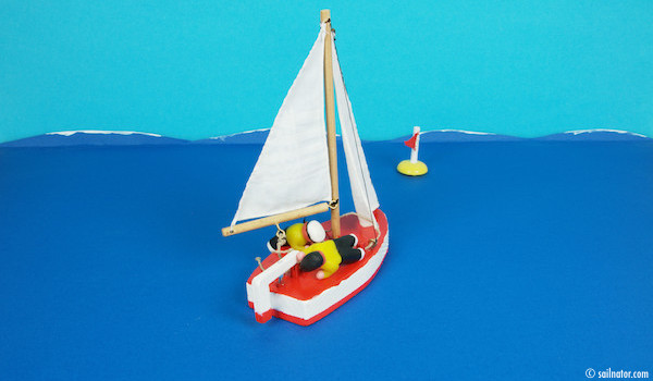 Figure 144: The boat is raised, but now there is the risk of capsizing to the opposite side. The lighter crewmember has to grab the tiller quickly now and the heavier crewmember has to stabilise the boat with his weight.